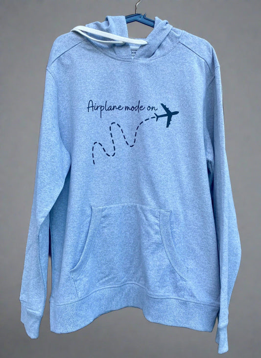 gray hoodie with "Airplane mode on" printed in black with a black airplane flying underneath the print.