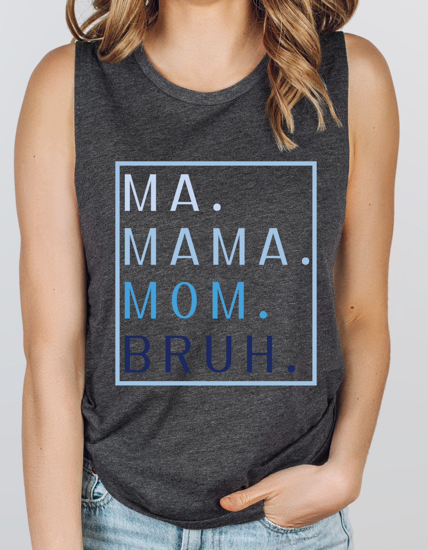 Gray festival tank with MA. MAMA. MOM. BRUH. printed vertically on top of each other in varying shades of blue. The lightest shade of blue is at the top. Then there is a light blue box around the print as well.