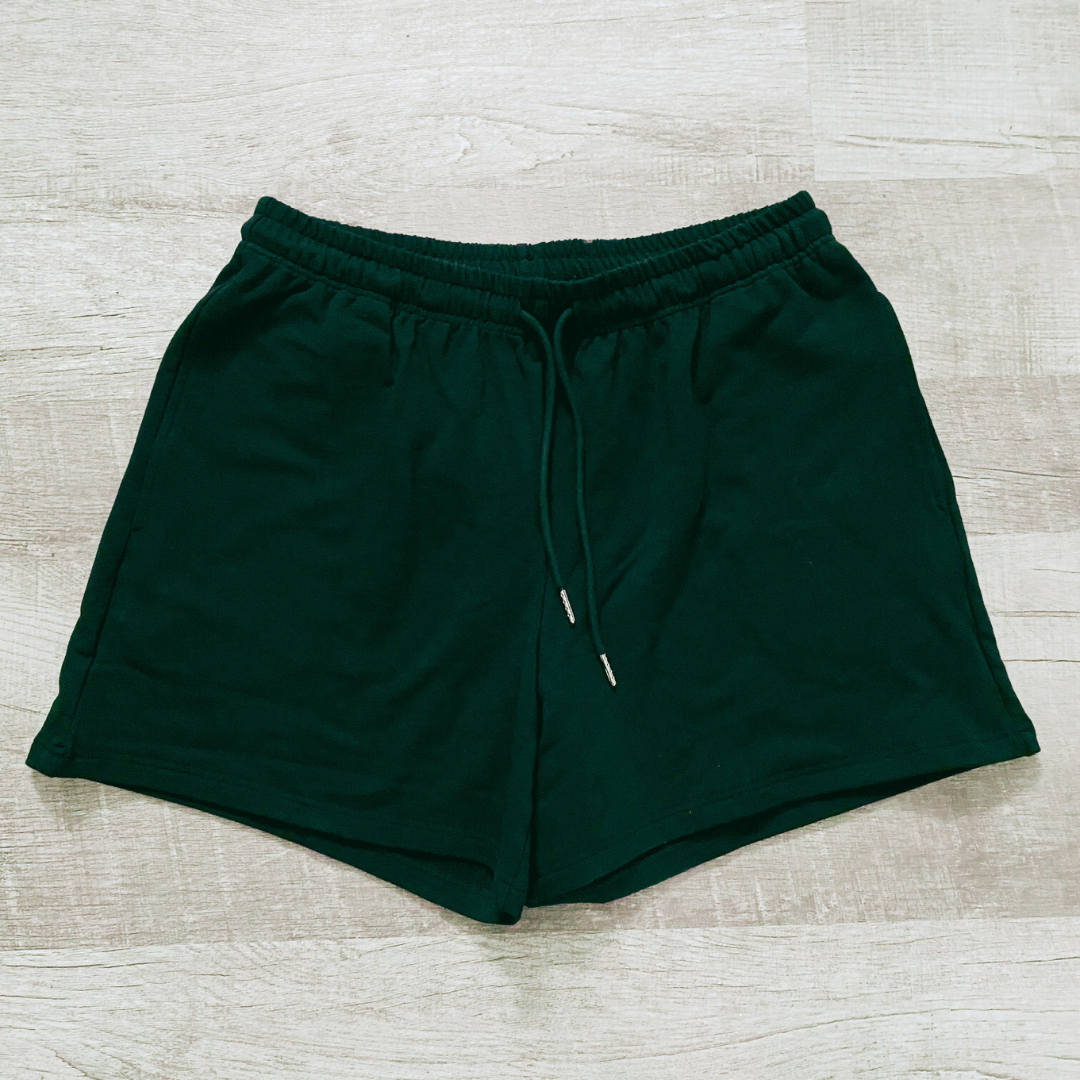 Black bamboo shorts with elastic waist and drawstrings. The drawstrings have silver tips on the end.