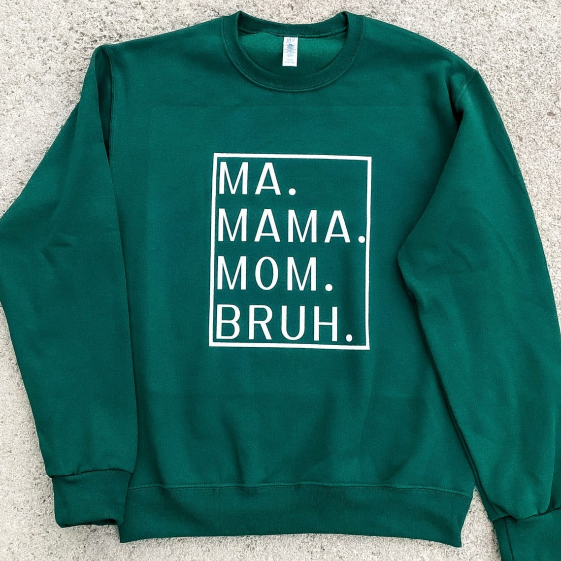 Forest Green Crewneck Sweatshirt with a White Box printed on the Front with Ma. Mama. Mom. Bruh. printed in the box.