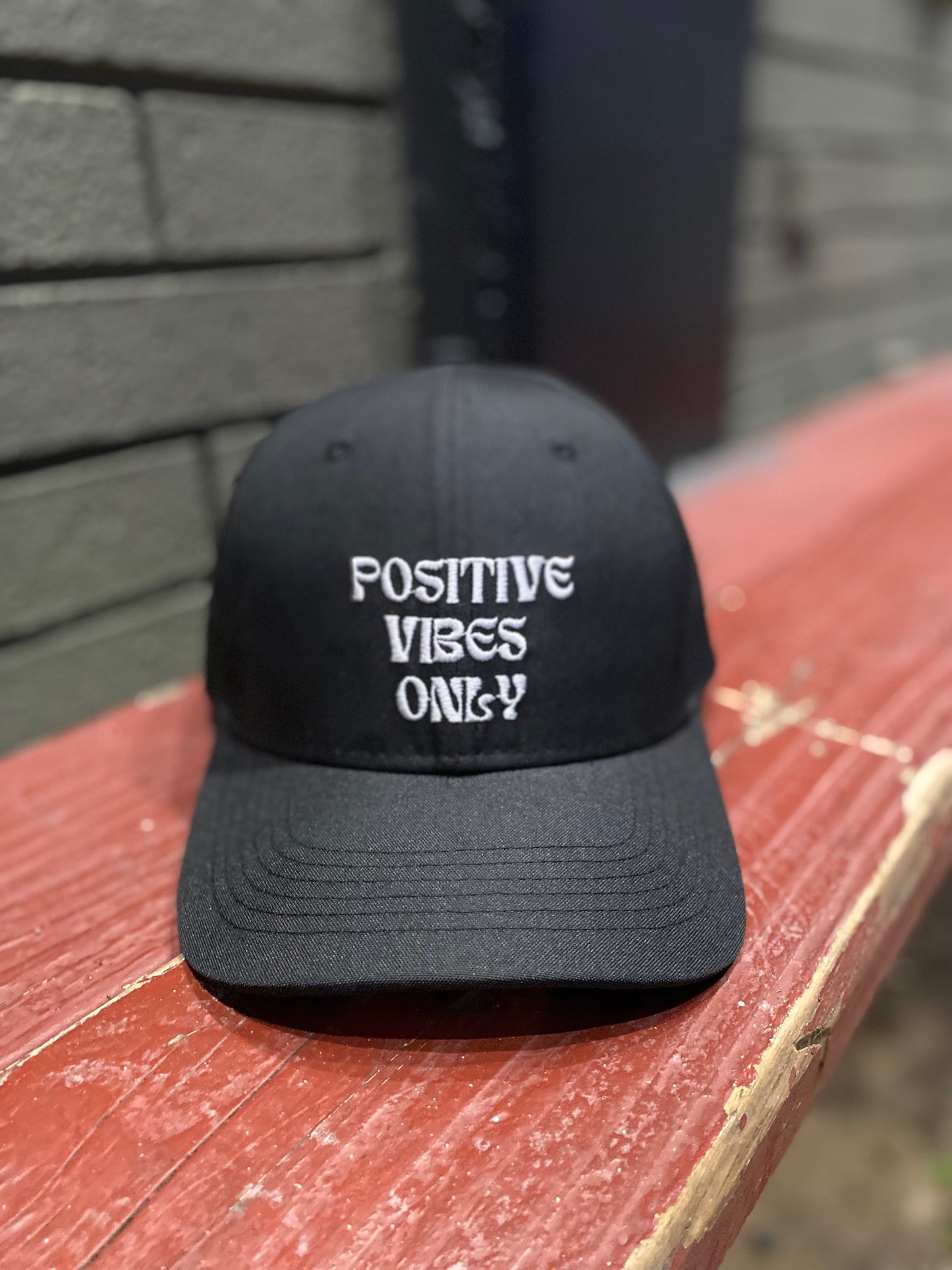 Black hat with Positive Vibes Only embroidered on the front in white