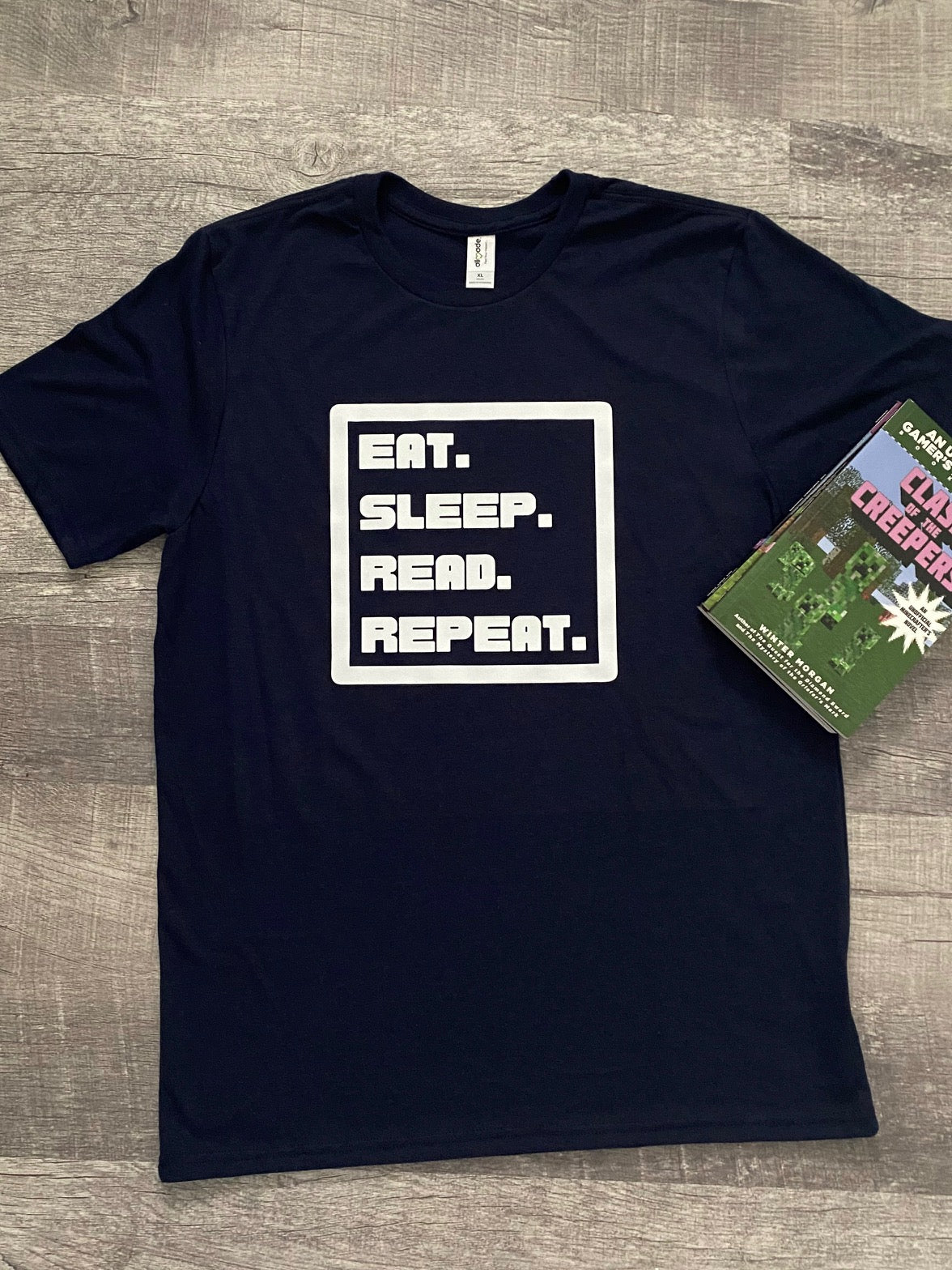 Eat. Sleep. Read. Repeat. Kids Eco-Friendly T-Shirt